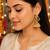 Traditional south indian gold plated jhumka earrings with green stones & pearl drops