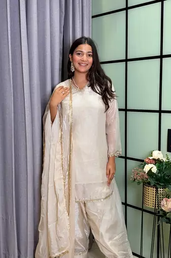 white color mirror and moti embellished lace border silk blend kurti pant set