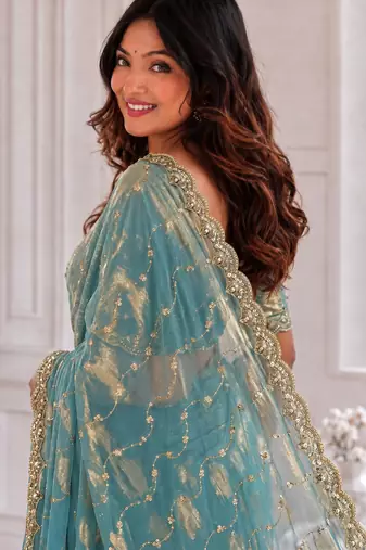 fetching sea-green embroidery work with real bits work fendy satin latest designer indian saree