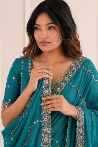 glamorous teal blue embroidery work with real bits work fendy satin indian designer saree