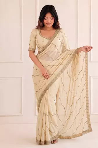 graceful white embroidery work with real bits work fendy satin indian designer wedding saree