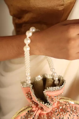 Peach satin potli bag