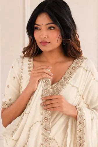 graceful white embroidery work with real bits work fendy satin indian designer wedding saree