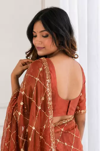 charming rust orange embroidery work with real bits work fendy satin indian designer saree