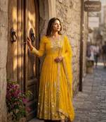 Yellow faux georgette embroidered flared gown set