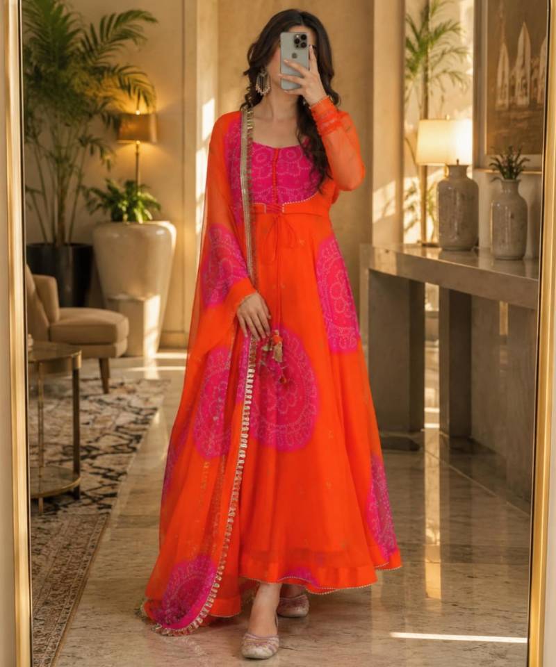 Orange faux georgette printed flared gown set