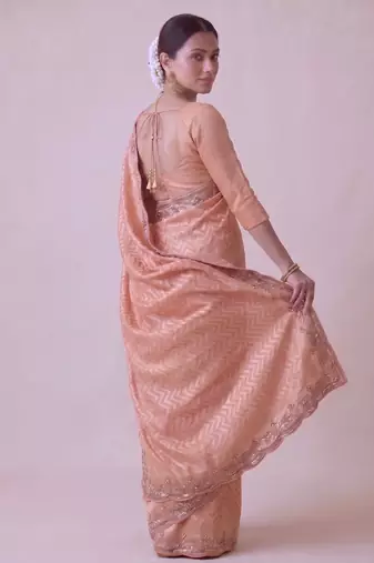 appealing peach-coral embroidery work with real bits work banarasi silk blend indian saree with blouse