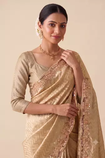 engaging beige-gold embroidery work with real bits work banarasi silk blend indian designer wedding saree