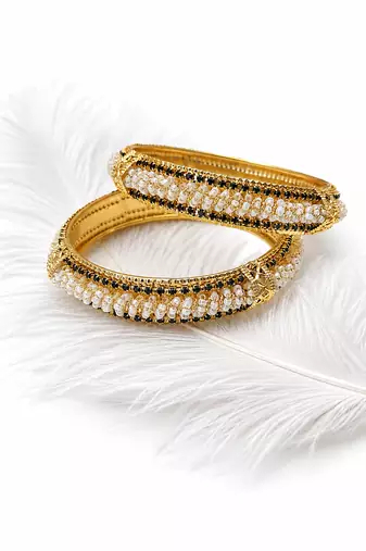 Gold-toned pearl bangle set with ruby & emerald stones set of 4 bangles, traditional design, festive wear.