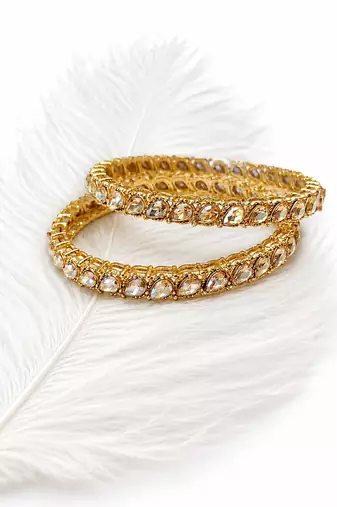 Gold-toned pearl bangle set with ruby & emerald stones set of 4 bangles, traditional design, festive wear.