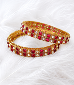 Gold-toned pearl bangle set with ruby & emerald stones