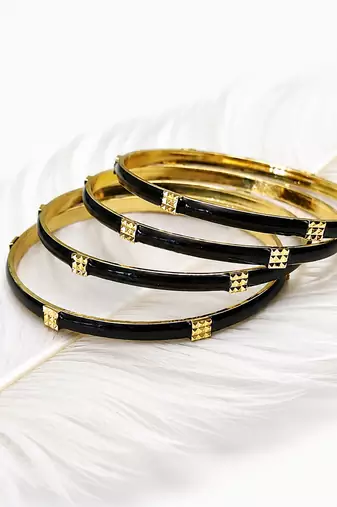 Gold-toned pearl bangle set with ruby & emerald stones set of 4 bangles, traditional design, festive wear.