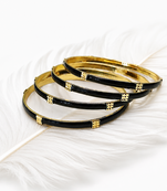 Gold-toned pearl bangle set with ruby & emerald stones set of 4 bangles, traditional design, festive wear.