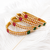 Gold-toned pearl bangle set with ruby & emerald stones set of 4 bangles, traditional design, festive wear.