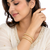 Gold-toned pearl bangle set with ruby & emerald stones set of 4 bangles, traditional design, festive wear.