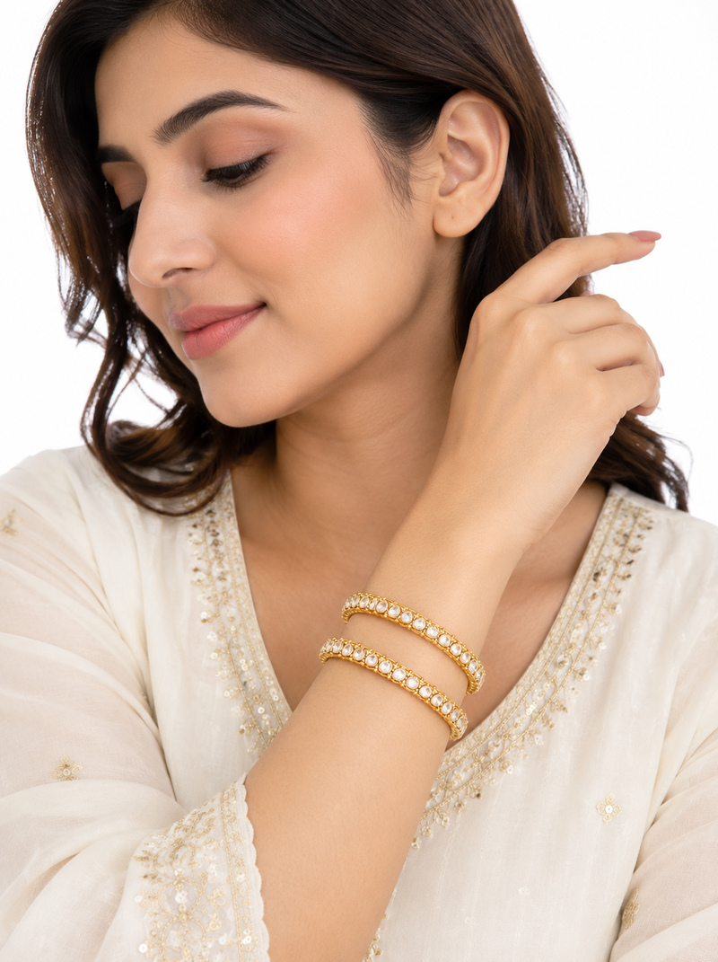 Gold-toned pearl bangle set with ruby & emerald stones set of 4 bangles, traditional design, festive wear.