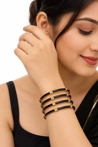 Gold-toned pearl bangle set with ruby & emerald stones set of 4 bangles, traditional design, festive wear.
