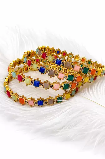 Gold-toned kundan bangles with teardrop stones, set of 2 filigree design, ethnic wear, white stone embellished.