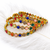 Gold-toned kundan bangles with teardrop stones, set of 2 filigree design, ethnic wear, white stone embellished.