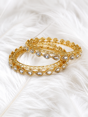 Gold-toned kundan bangles with teardrop stones, set of 2 filigree design, ethnic wear, white stone embellished. 1