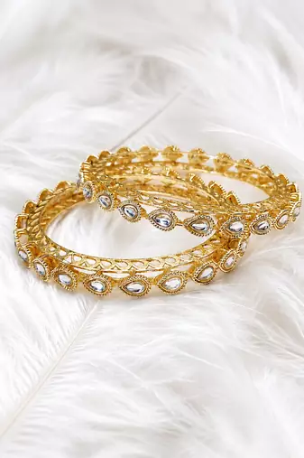 Gold-toned kundan bangles with teardrop stones, set of 2 filigree design, ethnic wear, white stone embellished.