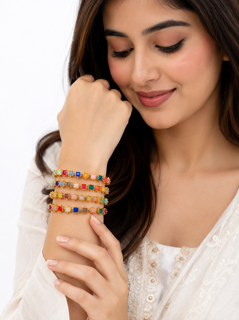 Gold-toned kundan bangles with teardrop stones, set of 2 filigree design, ethnic wear, white stone embellished.