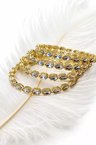 Gold-toned crystal bangles set of 4 for women kundan-style stones, stackable design, festive wear, hexagonal motifs.