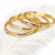 Gold-plated bangle set with crystal embellishments, set of 4 diamond-cut accents, women's jewellery, stackable design.