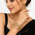 Gold-toned crystal bangles set of 4 for women kundan-style stones, stackable design, festive wear, hexagonal motifs.