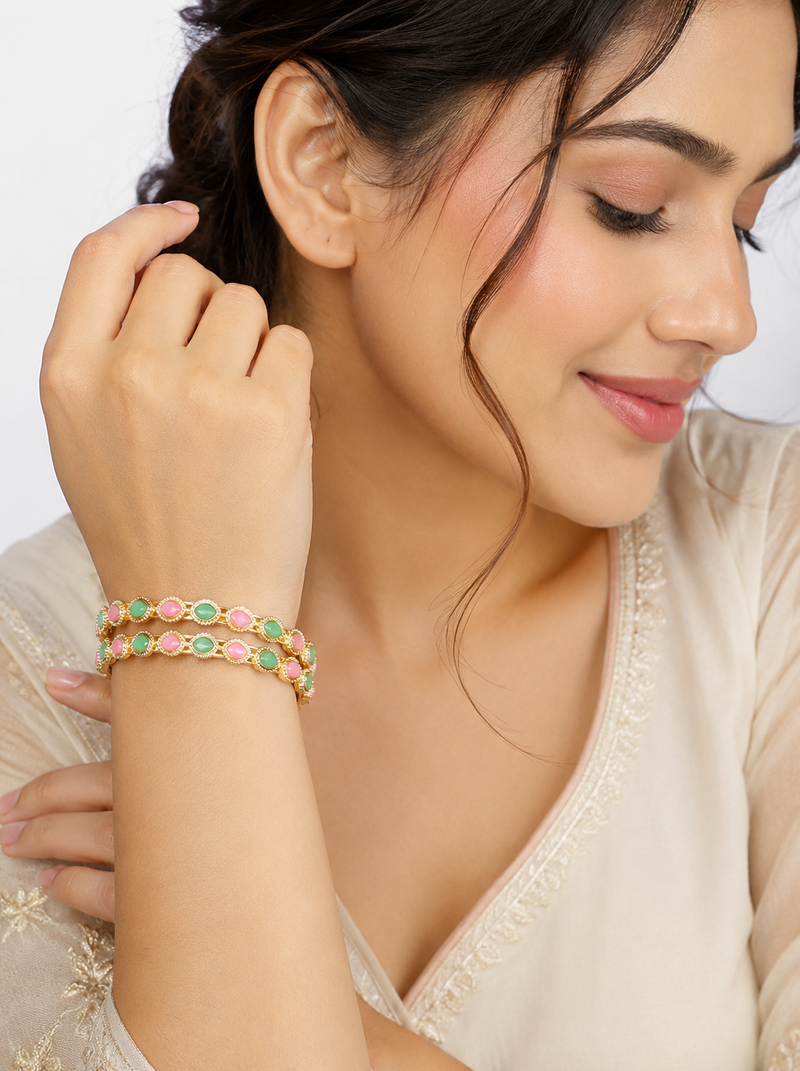 Gold-toned bangles with pink & green teardrop stones, set of 2 filigree design.