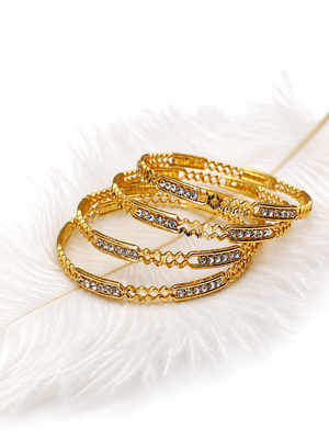 Gold-toned crystal studded bangles set of 4 for women rhinestone embellished, stackable design, ethnic wear. 1