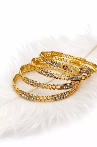 Gold-toned crystal studded bangles set of 4 for women rhinestone embellished, stackable design, ethnic wear.