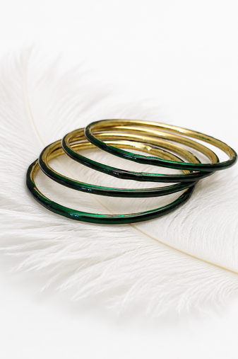Gold-toned crystal studded bangles set of 4 for women rhinestone embellished, stackable design, zigzag chain pattern.