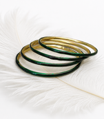 Gold-toned crystal studded bangles set of 4 for women rhinestone embellished, stackable design, zigzag chain pattern.