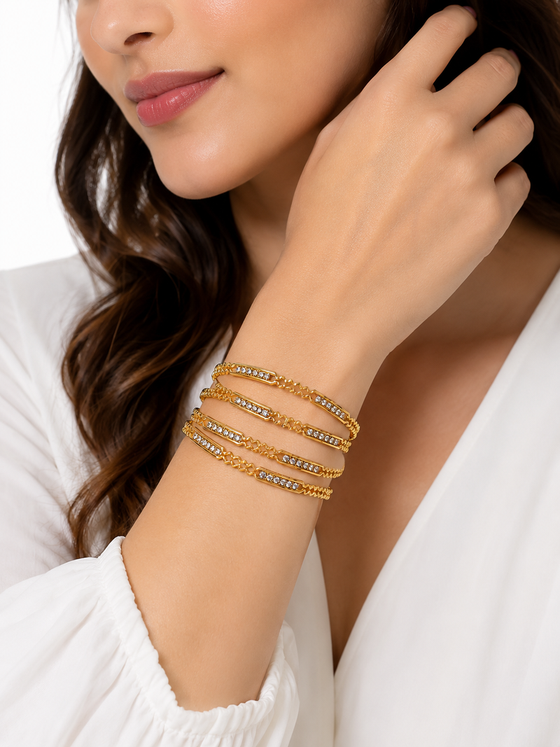 Gold-toned crystal studded bangles set of 4 for women rhinestone embellished, stackable design, ethnic wear.