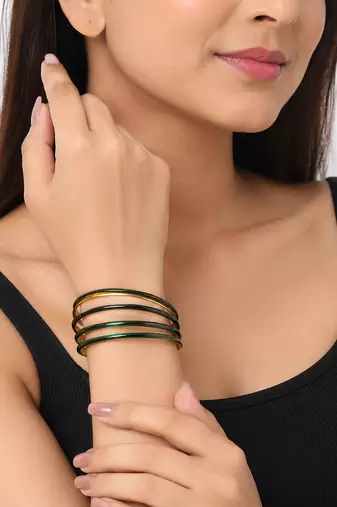 Gold-toned crystal studded bangles set of 4 for women rhinestone embellished, stackable design, zigzag chain pattern.