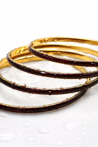Gold-toned maroon enamel bangle set for women, set of 4 enamel finish, stackable design.
