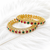Gold-toned bangles with red and green stone set of 2 filigree design, round cabochon stones