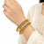 Gold-toned bangles with red and green stone set of 2 filigree design, round cabochon stones