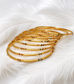 Gold-toned bangle set with enamel detail