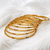Gold-toned bangle set with enamel detail