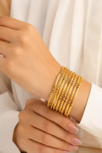 Gold-toned bangle set with enamel detail