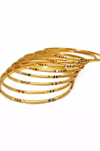 Gold-toned bangle set with enamel detail