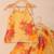 Sunshine yellow floral kota doria tie-up top & flared palazzo set