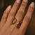 Twisted gold tone statement ring