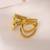 Twisted gold tone statement ring