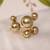 Multi pearl gold tone statement ring