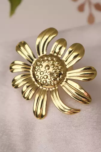 Floral gold tone statement ring