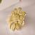 Floral gold tone statement ring