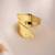 Curved gold tone statement ring